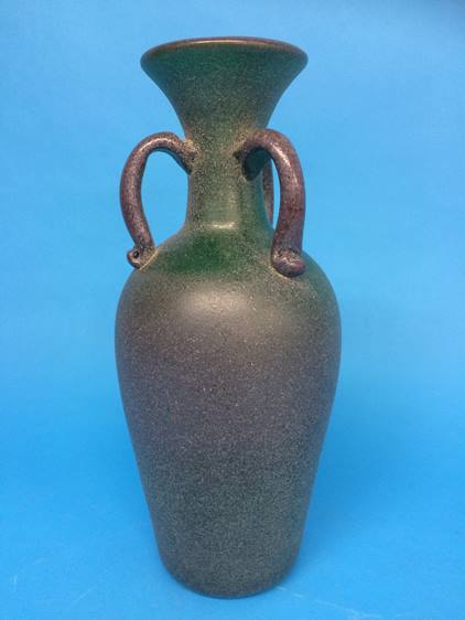 An Antique style speckled green glass three handled vase