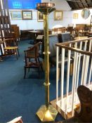 A large brass Ecclesiastical octagonal candle stand, 157cm high