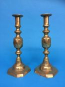 A pair of brass candlesticks