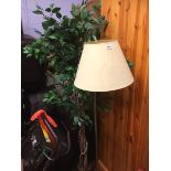 An artificial tree and a lamp