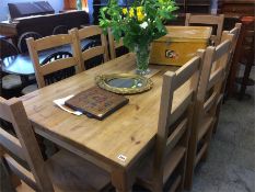 A pine farmhouse refectory table and 8 chairs