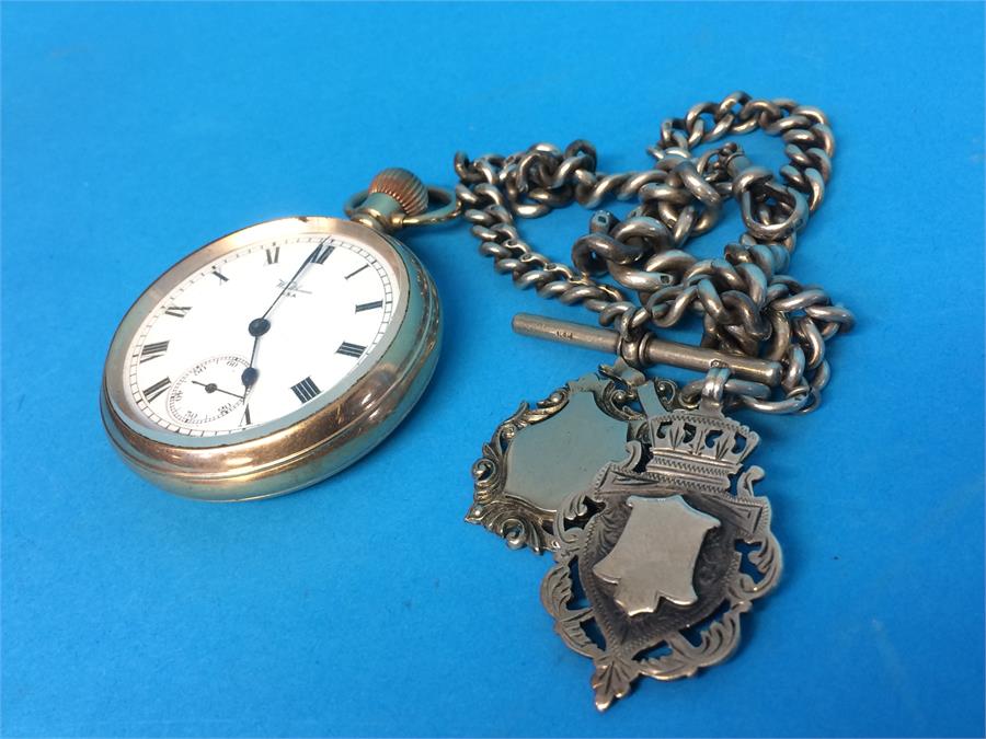 A gold plated Waltham pocket watch, together with a silver Albert