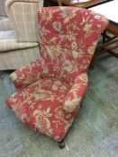 A rouge floral pattern button back chair