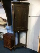 An oak corner cabinet and stand