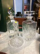 Three cut glass decanters