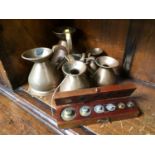 A set of 6 graduated copper measures and boxed brass weights