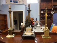 A pair of table lamps and one other