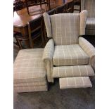 A Parker Knoll armchair with footstool of beige tartan pattern