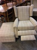 A Parker Knoll armchair with footstool of beige tartan pattern