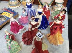 Twelve Doulton and Coalport figures etc.