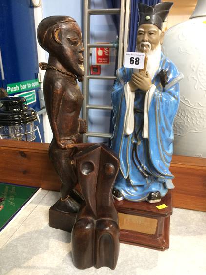 Two wood figures and an Oriental Sage