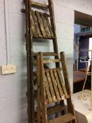Two sets of wooden ladders