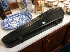 A violin coffin case and a violin bow