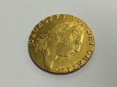 A George III gold Spade guinea coin, dated 1798, weight 8.4g
