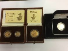 A 2005 UK gold proof sovereign, 22ct, weight 7.98g, a Britannia two coin set, 22ct gold, weight 8.5g
