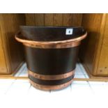 A mahogany peat bucket, with copper handle and three copper bands, 30 cm high