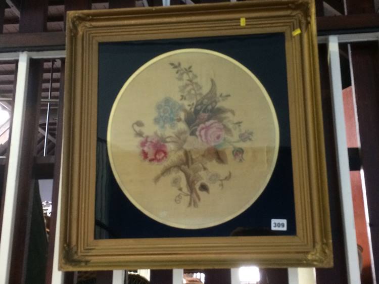 A 19th century embroidered silk work circular panel, still life, framed