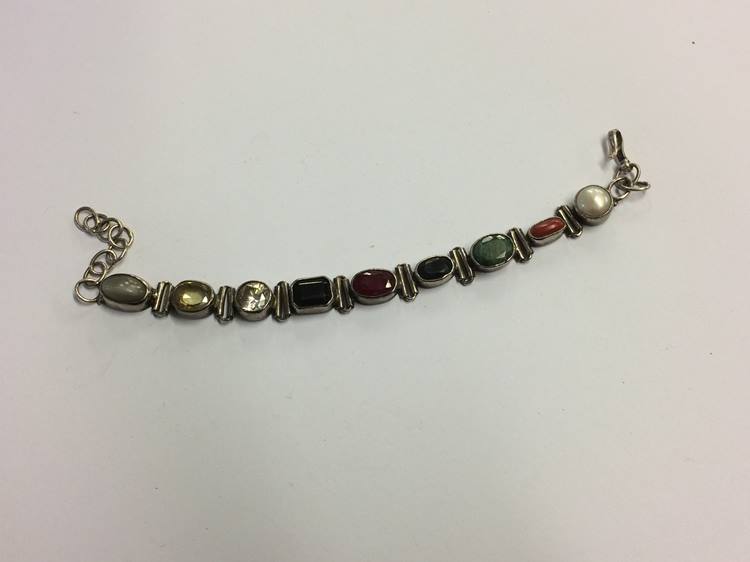 An Indian silver coloured bracelet, set with semi-precious and other stones