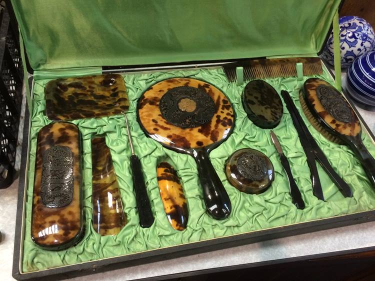 A faux tortoishell Oriental design dressing table set (boxed)