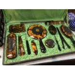 A faux tortoishell Oriental design dressing table set (boxed)