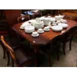 A mahogany extending dining table with two leaves and a set of six Victorian mahogany chairs