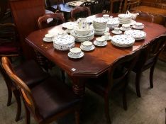 A mahogany extending dining table with two leaves and a set of six Victorian mahogany chairs