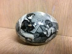 A Victorian pottery egg transfer, printed with scenes 'Androcles and the lion' and an 'Interior