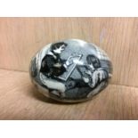 A Victorian pottery egg transfer, printed with scenes 'Androcles and the lion' and an 'Interior
