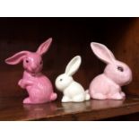 A rare pink Sylvac rabbit, numbered 1303, 17.5cm high and 2 other Sylvac rabbits