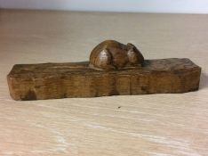 Piece of oak with carved Mouseman motif