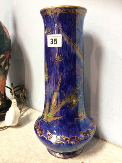 A tall Wedgwood lustreware vase, decorated with exotic birds and swans, 31cm high