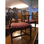 A set of reproduction mahogany chairs comprising four single and two carvers