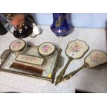 A seven piece dressing table set