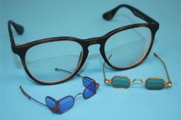 Two pairs of early 20th century miniature optician sample glasses, one pair with octagonal lenses