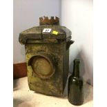 A green glass L.N.E.R. bottle and a cast iron L.N.E.R. railway lamp