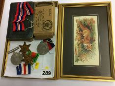 Group of four unnamed World War II medals etc.