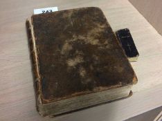 Leather bound bible,printed by Robert Barker London dated 1603 and a miniature book of common