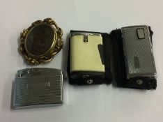 Mourning brooch and lighters