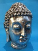 A silver coloured Buddha's Head