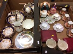 Two trays including Royal Doulton figures, Royal Crown Derby coffee cans etc.
