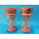 A pair of Victorian pink glass lustres with gilt foliate decoration