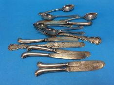 A sterling silver knife and fork, various spoons etc.