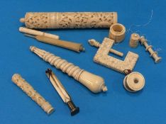 A collection of various ivory bobbins, seals etc.