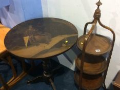 An Edwardian cake stand and a lacquered tripod table