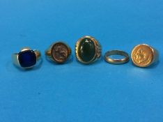 A collection of various Continental yellow metal rings