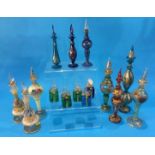 A Collection of nine decorative glass Bohemian style scent bottles, all decorated with enamels and