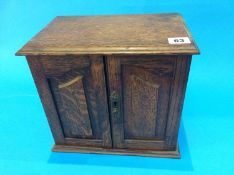 A small oak Smoker's cabinet