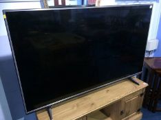 A large LG TV (Remote in office)