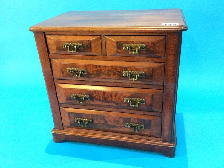 An Edwardian miniature apprentice price mahogany chest of two short and three long graduated