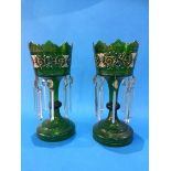 A pair of Victorian green glass and painted enamelled lustres, with clear glass drops. 30 cm high